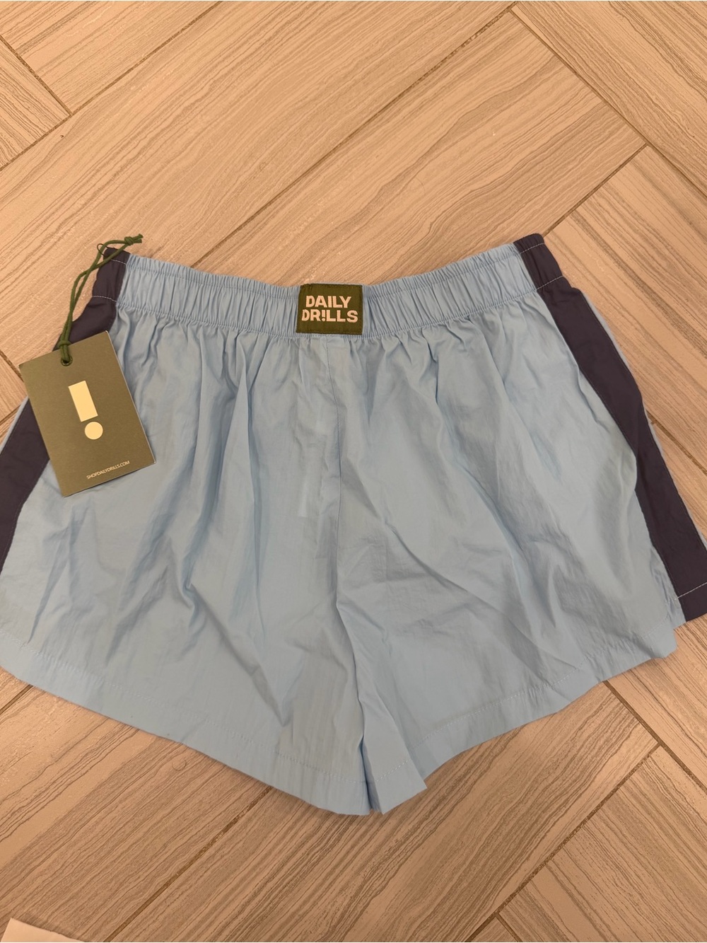 NWT Daily Drills First String Shorts
Malibu + Navy
Size S